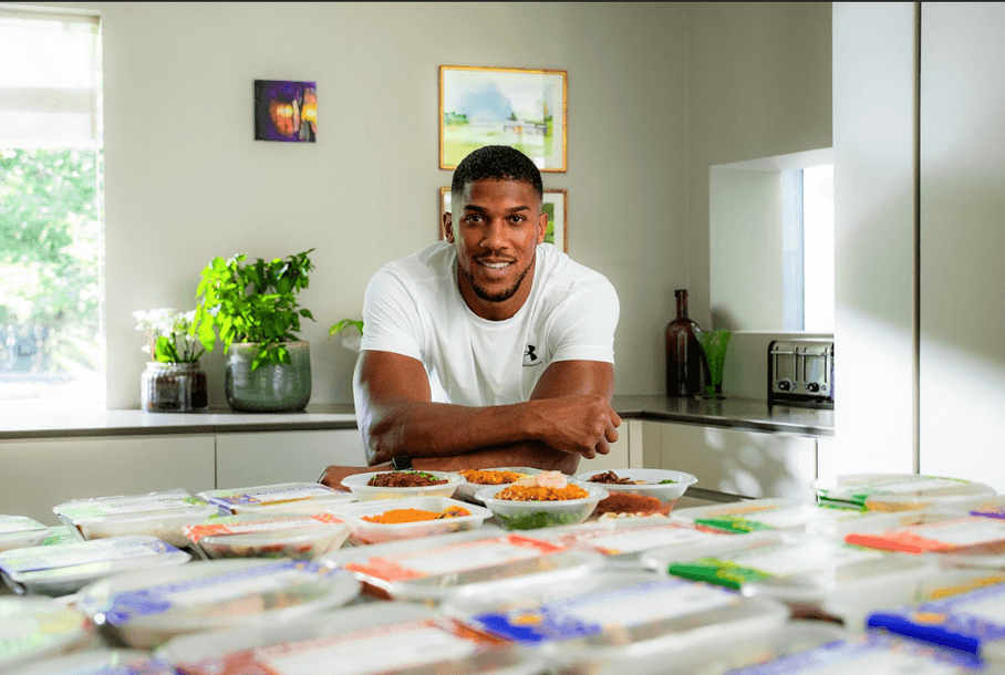 Anthony Joshua with the specially-designed range of Prep Kitchen meals he's inspired