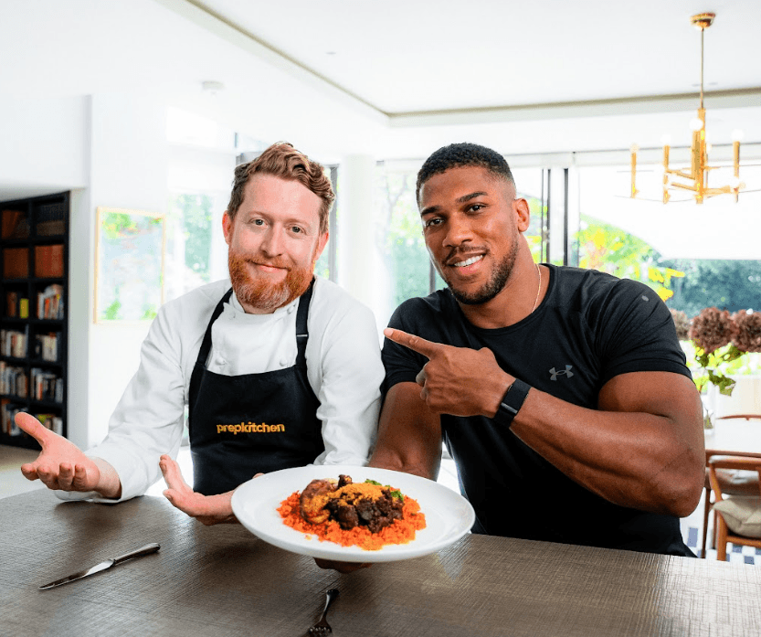 Prep Kitchen's Head Chef Paul Mason & Anthony Joshua with one of the brand's special AJ-inspired meals